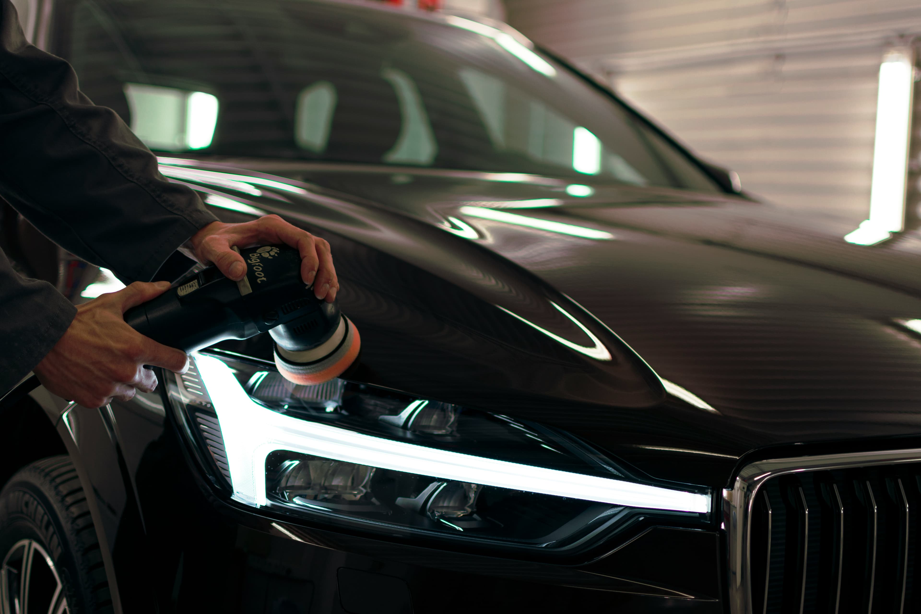 A vehicle receiving a professional machine polish